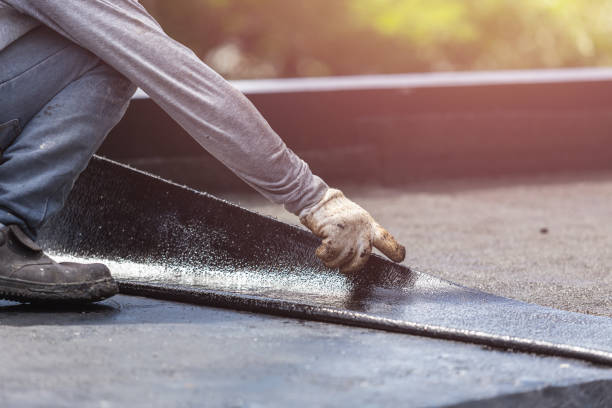 Professional Waterproofing technician working in Woodstock, AL